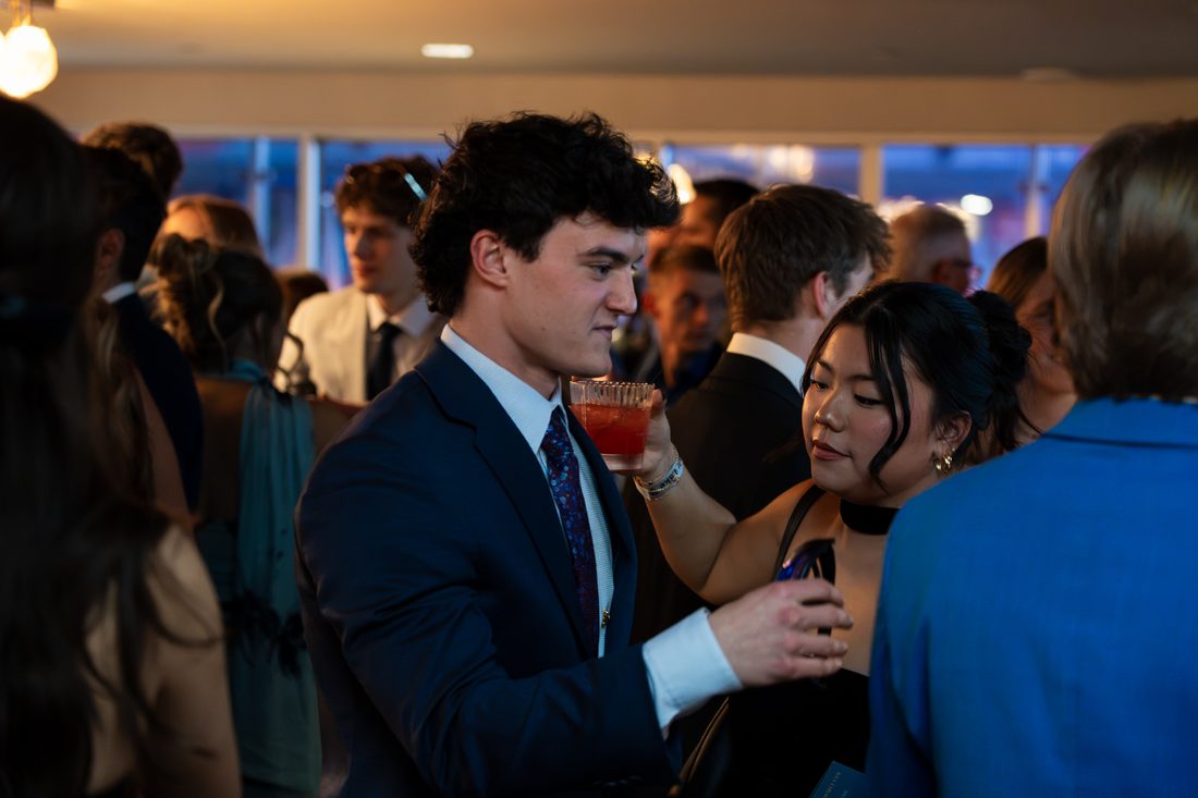 Guests conversing at Blue Tie Gala